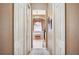Hallway view into a well-appointed bathroom with soaking tub at 5200 Pebble Beach Blvd, Winter Haven, FL 33884