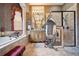 Detailed bathroom boasting tiled floors, an exquisite vanity, and a tiled walk-in shower with glass door at 5200 Pebble Beach Blvd, Winter Haven, FL 33884