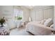 Charming bedroom with floral accents, including vanity area, and an abundance of natural light at 5200 Pebble Beach Blvd, Winter Haven, FL 33884