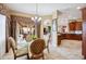 Breakfast nook adjacent to the kitchen offers views of the patio and pool at 5200 Pebble Beach Blvd, Winter Haven, FL 33884