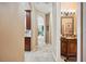 Hallway view to other living spaces and bathroom vanity at 5200 Pebble Beach Blvd, Winter Haven, FL 33884