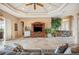 Spacious living room with large windows, tile flooring, and access to other living spaces at 5200 Pebble Beach Blvd, Winter Haven, FL 33884