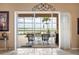 Relaxing patio with pool view through sliding glass doors at 5200 Pebble Beach Blvd, Winter Haven, FL 33884