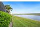 Scenic water view showcasing the tranquil backyard on a clear day at 5200 Pebble Beach Blvd, Winter Haven, FL 33884