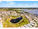 Breathtaking aerial view of a waterfront community with lush landscaping, serene lakes, and well-maintained homes at 530 Eastlake Dr, Haines City, FL 33844