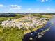 Aerial view of a neighborhood with houses, lakes, trees, and docks at 530 Eastlake Dr, Haines City, FL 33844