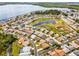 Aerial view of a neighborhood with houses, golf course, lake, and trees. The subject house is highlighted in red at 530 Eastlake Dr, Haines City, FL 33844