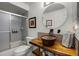 Stylish bathroom featuring a unique vessel sink, modern fixtures, and a shower-tub combination at 530 Eastlake Dr, Haines City, FL 33844