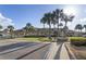 The community clubhouse features lush landscaping and an inviting outdoor space at 530 Eastlake Dr, Haines City, FL 33844