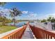 A wooden dock extends from the property into the calm lake, providing a scenic view at 530 Eastlake Dr, Haines City, FL 33844