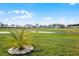 Scenic view of a lush green golf course with clear skies and well-maintained landscaping at 530 Eastlake Dr, Haines City, FL 33844