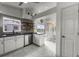 Open kitchen boasts modern appliances, marble floors and a dining area with large windows at 530 Eastlake Dr, Haines City, FL 33844