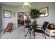 Enclosed lanai featuring tile flooring and a table with chairs, perfect for relaxation and enjoying views at 530 Eastlake Dr, Haines City, FL 33844