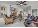 Bright living room features tile floors, neutral tones, and contemporary decor at 530 Eastlake Dr, Haines City, FL 33844