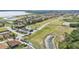 Panoramic aerial view of golf course community with lake and clubhouse at 5341 Hogan Ln, Winter Haven, FL 33884