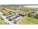 Overhead shot shows the golf course and golf cart parking by the clubhouse at 5341 Hogan Ln, Winter Haven, FL 33884