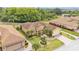 Beautiful aerial view of a home featuring manicured lawns, lush landscaping, and a brick-paved driveway at 5341 Hogan Ln, Winter Haven, FL 33884