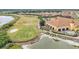 Beautiful aerial view of a golf course and clubhouse at 5341 Hogan Ln, Winter Haven, FL 33884
