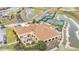 Overhead shot of clubhouse amenities, including patio dining and tennis courts at 5341 Hogan Ln, Winter Haven, FL 33884