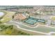 Aerial view of community clubhouse, pools, and tennis courts at 5341 Hogan Ln, Winter Haven, FL 33884