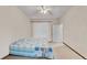 Bright bedroom with a window, ceiling fan, neutral walls, and carpet at 5341 Hogan Ln, Winter Haven, FL 33884