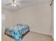 Cozy bedroom featuring a blue bedspread and soft carpeting at 5341 Hogan Ln, Winter Haven, FL 33884