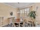 Charming dining room with a round table, complemented by a decorative chandelier and natural light at 5341 Hogan Ln, Winter Haven, FL 33884