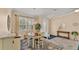 Elegant dining room with a wooden table, complemented by custom window shutters at 5341 Hogan Ln, Winter Haven, FL 33884