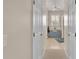 Hallway view leading to a bedroom and bathroom, showcasing the home's layout at 5341 Hogan Ln, Winter Haven, FL 33884