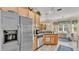 Bright kitchen with stainless steel refrigerator and adjacent breakfast nook at 5341 Hogan Ln, Winter Haven, FL 33884