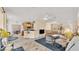 Bright, open-concept living area connects to dining and kitchen, perfect for modern living at 5341 Hogan Ln, Winter Haven, FL 33884