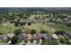 Expansive aerial view of homes nestled along a golf course, showcasing community living at 571 Saint Andrews Rd, Winter Haven, FL 33884