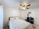 Neutral bedroom featuring a ceiling fan, neutral walls, and tile floors at 571 Saint Andrews Rd, Winter Haven, FL 33884