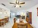 Dining area with a wooden table and chairs, seamlessly connected to the living room for easy entertaining and Gathering meals at 571 Saint Andrews Rd, Winter Haven, FL 33884