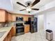 Well-equipped kitchen featuring stainless steel appliances, granite countertops, and wood cabinetry, offering modern functionality and style at 571 Saint Andrews Rd, Winter Haven, FL 33884