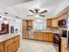 Bright kitchen offers stainless appliances, granite counters, and tile floor at 571 Saint Andrews Rd, Winter Haven, FL 33884