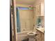 Cozy bathroom features a shower-tub combo, a sink with a cabinet, and a medicine cabinet at 6107 Grand Oaks Se Dr, Winter Haven, FL 33884