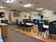 Large community hall setup with tables, chairs, a dance floor, and decorative accents for gatherings at 6107 Grand Oaks Se Dr, Winter Haven, FL 33884
