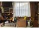 Garage with disorganized shelves with tools, containers, a window, and a drop light at 6107 Grand Oaks Se Dr, Winter Haven, FL 33884