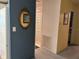 Hallway view featuring a mirror, closet doors, and access to other rooms at 6107 Grand Oaks Se Dr, Winter Haven, FL 33884