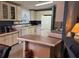 Spacious kitchen featuring a center island, and ample counter space with updated appliances at 6107 Grand Oaks Se Dr, Winter Haven, FL 33884