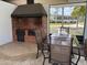 Outdoor grill with ample seating, perfect for entertaining guests with barbecues and outdoor gatherings at 6107 Grand Oaks Se Dr, Winter Haven, FL 33884