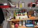 A full and functional pantry space with shelving filled with various household and food items at 6107 Grand Oaks Se Dr, Winter Haven, FL 33884