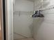 Spacious walk-in closet with ample storage, including shelving and hanging space at 6107 Grand Oaks Se Dr, Winter Haven, FL 33884