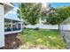 Backyard featuring a patio, garden bed, lawn, shed, and fence at 612 Ralph St, Auburndale, FL 33823