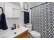 Well-maintained bathroom with modern fixtures, vanity, and stylish shower curtain at 612 Ralph St, Auburndale, FL 33823