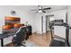 Bedroom area with a desk with three monitors, a treadmill and a closet at 612 Ralph St, Auburndale, FL 33823