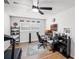 Bright bedroom with a treadmill, gaming chair, sports memorabilia, and wood flooring at 612 Ralph St, Auburndale, FL 33823