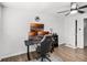 Bedroom area with a desk with three monitors, a ceiling fan and a closet at 612 Ralph St, Auburndale, FL 33823