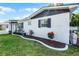 Charming home exterior with flower beds and a freshly painted facade at 612 Ralph St, Auburndale, FL 33823